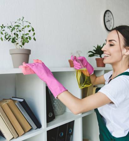 smiling-young-woman-in-rubber-gloves-cleaning-shel-2022-12-16-19-32-27-utc